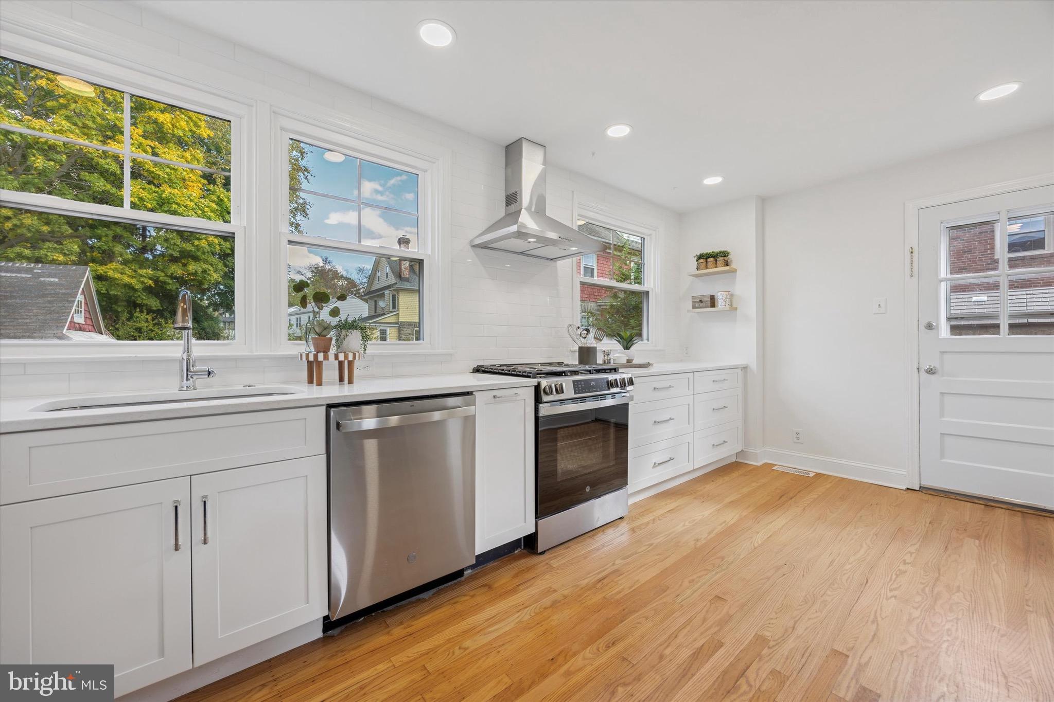 5 Llanfair Road Ardmore, PA 19003 - Photo 8 of 25 a kitchen with a sink cabinets stainless steel appliances and window