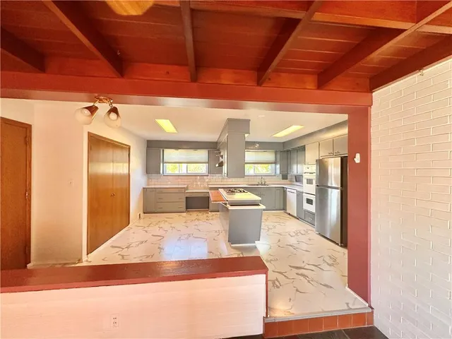 a lobby with furniture and window