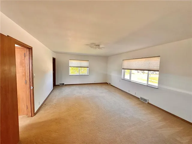 an empty room with windows