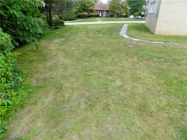a view of a golf course with a lake view