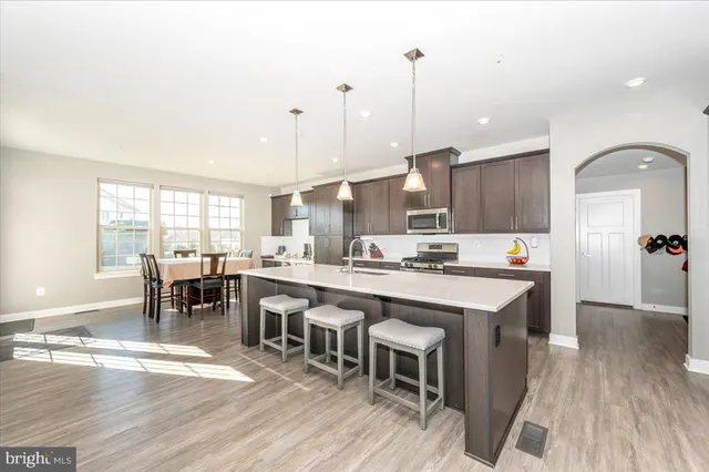 a view of a dining room with furniture and window