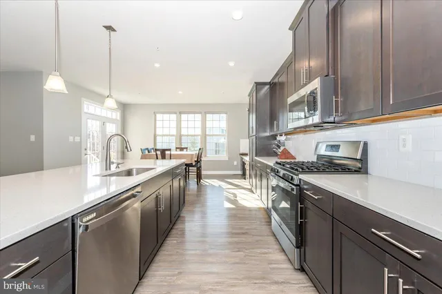 a view of walk in closet with clothes