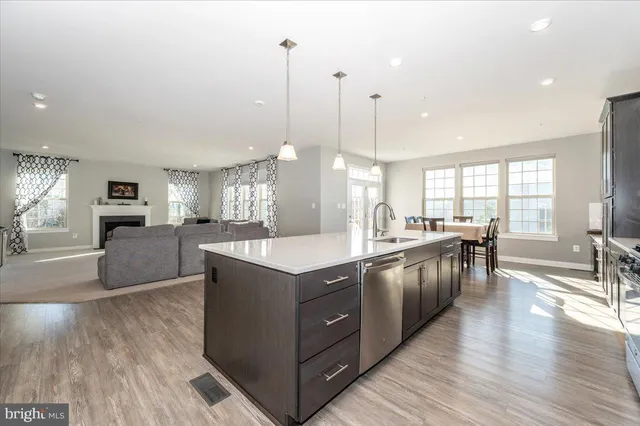 a bathroom with a double vanity sink mirror and shower