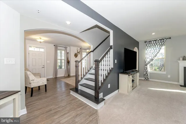 a living room with furniture and a table