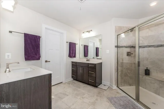 a view of a big house with a big yard and large trees