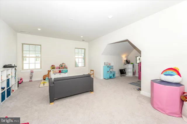 a house view with a sitting space and garden