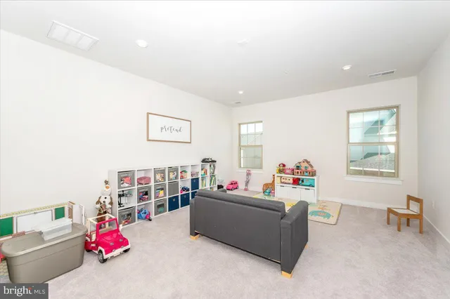 a view of a backyard with plants and a patio