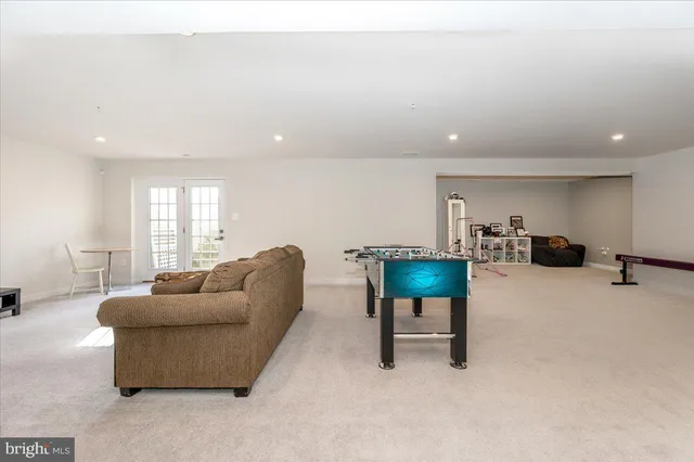 a view of swimming pool with a yard and a large tree