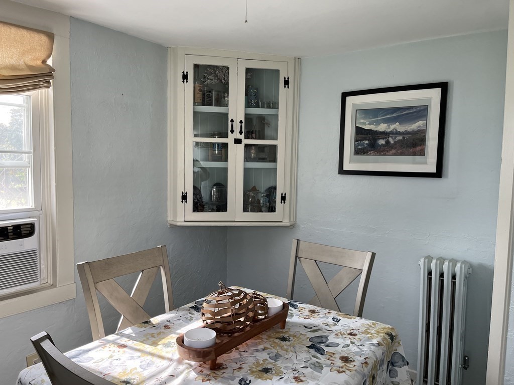 33 Singletary Avenue Sutton, MA 01590 - Photo 17 of 33 a bedroom with a bed and a chair