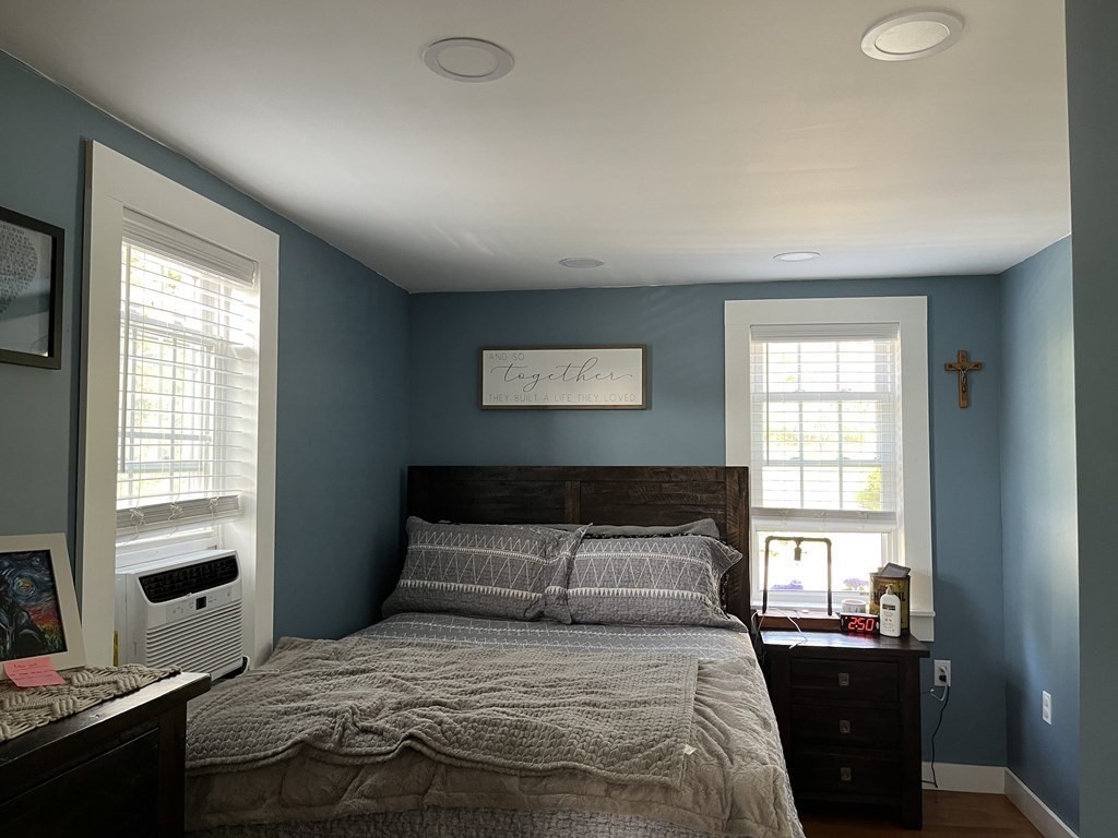 33 Singletary Avenue Sutton, MA 01590 - Photo 20 of 33 a bedroom with a bed and wooden floor