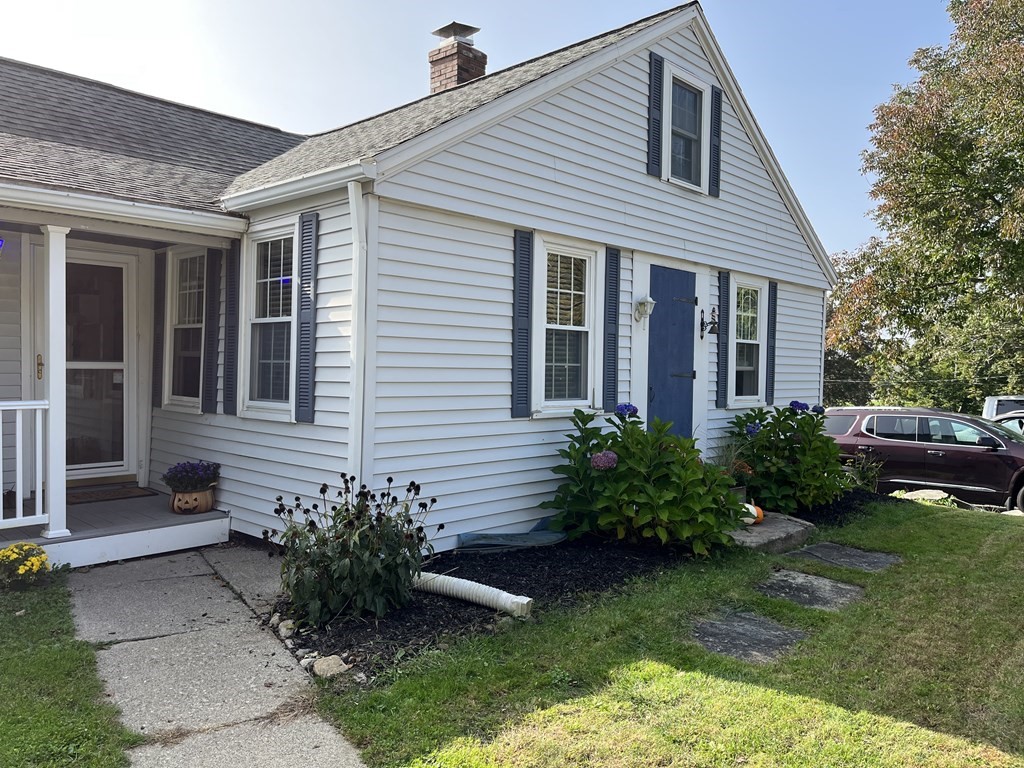 33 Singletary Avenue Sutton, MA 01590 - Photo 2 of 33 a front view of a house with a yard