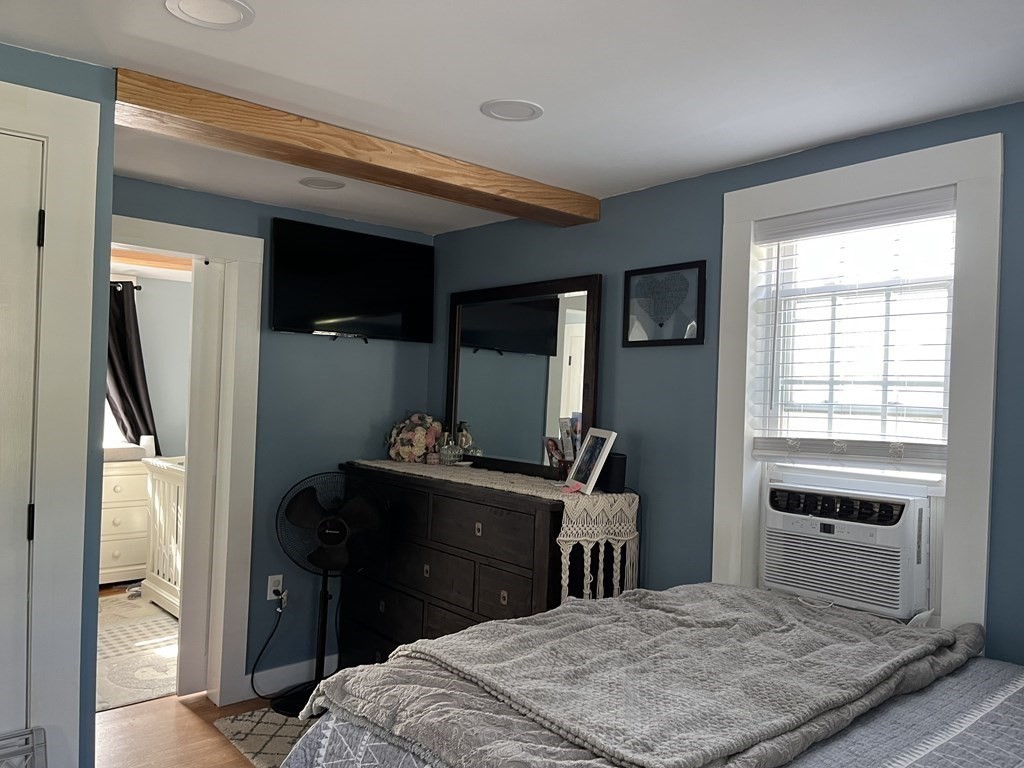 33 Singletary Avenue Sutton, MA 01590 - Photo 21 of 33 a bedroom with a bed and a dresser