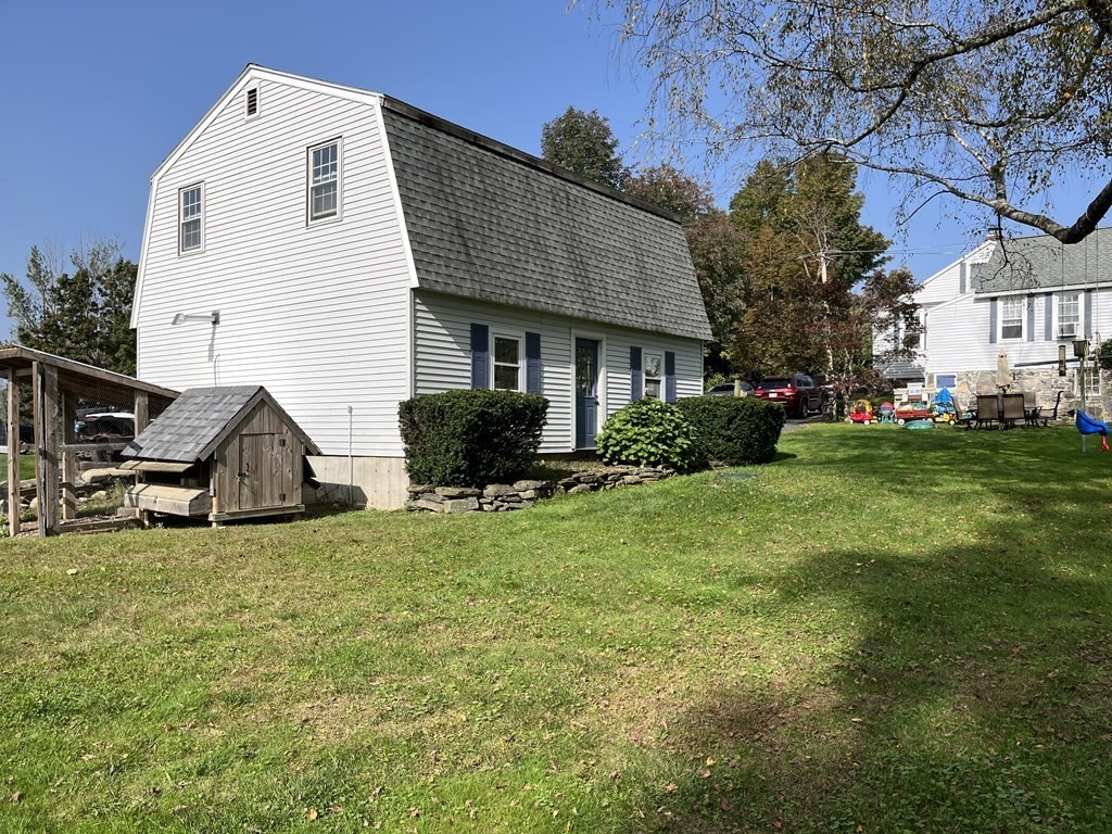33 Singletary Avenue Sutton, MA 01590 - Photo 30 of 33 a view of a house with a yard