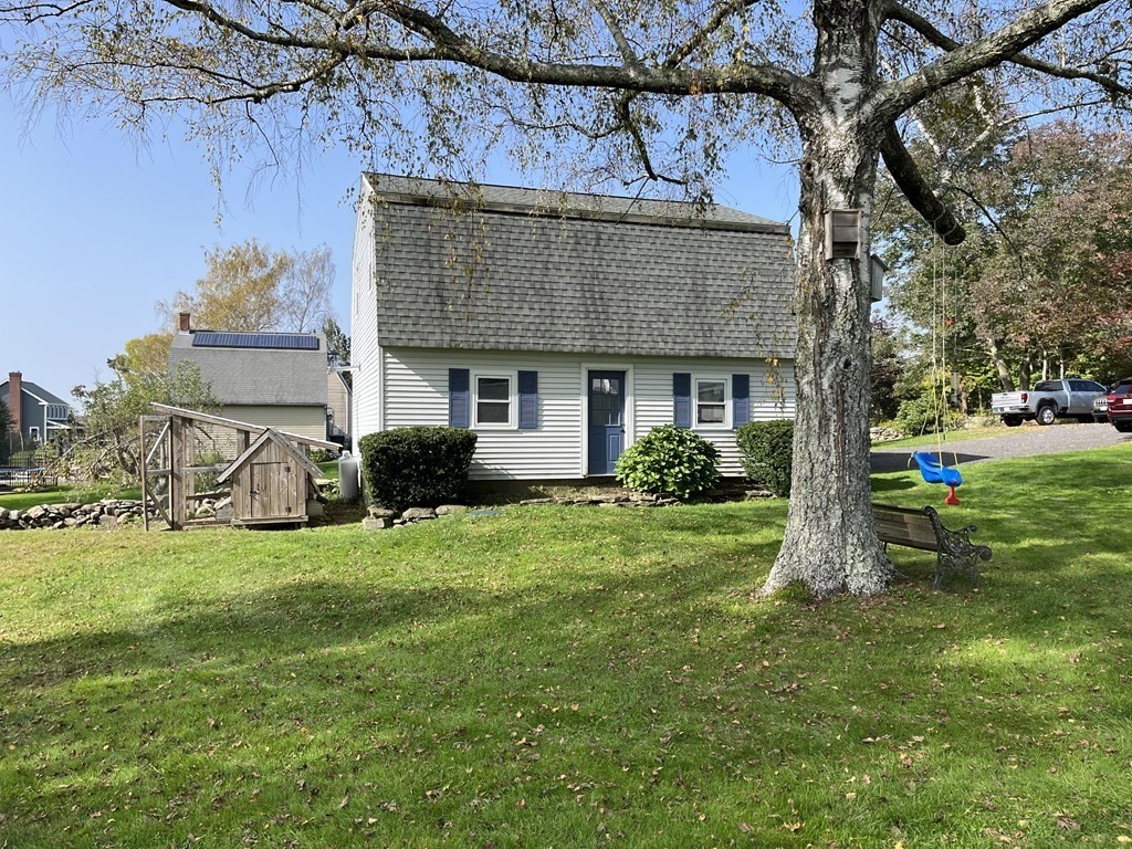 33 Singletary Avenue Sutton, MA 01590 - Photo 32 of 33 a front view of a house with a yard and garage