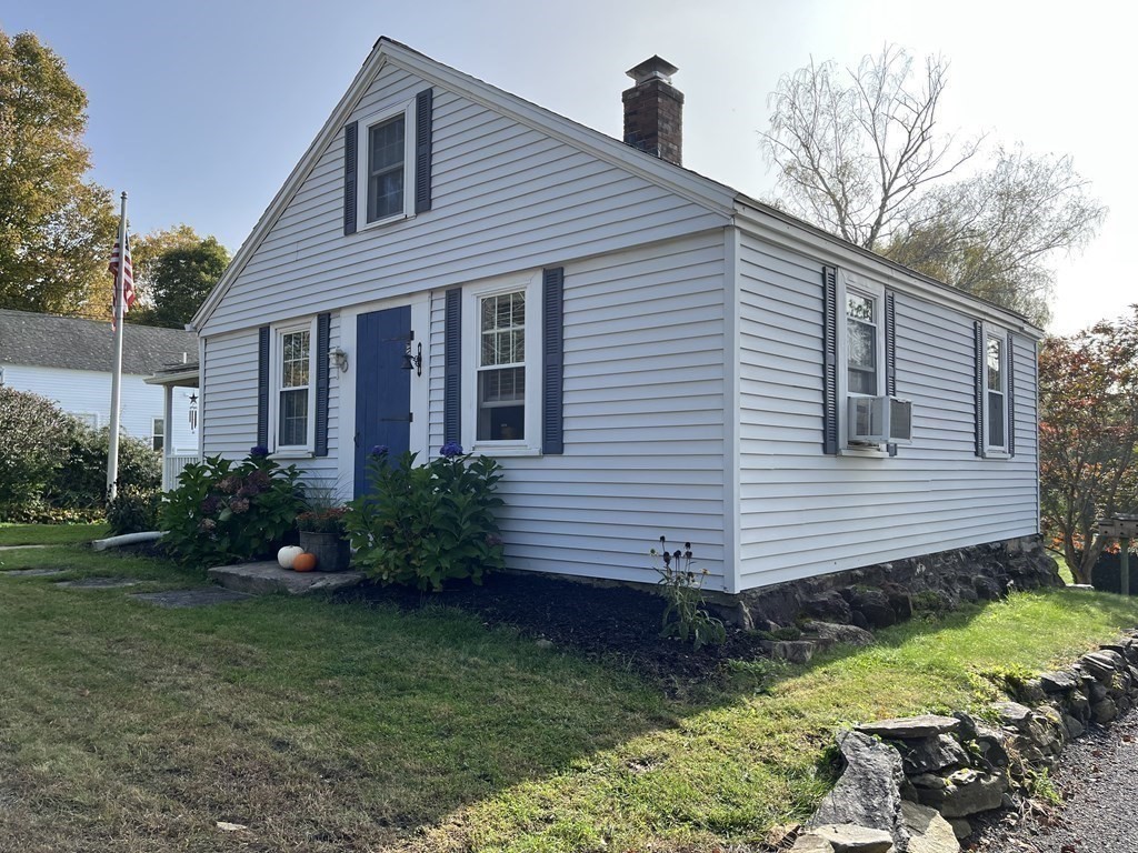 33 Singletary Avenue Sutton, MA 01590 - Photo 33 of 33 a front view of a house with garden