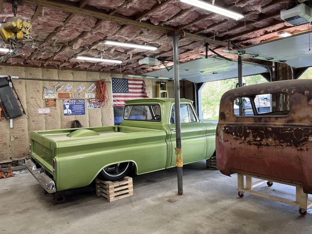 33 Singletary Avenue Sutton, MA 01590 - Photo 6 of 33 a green room with lots of wooden furniture