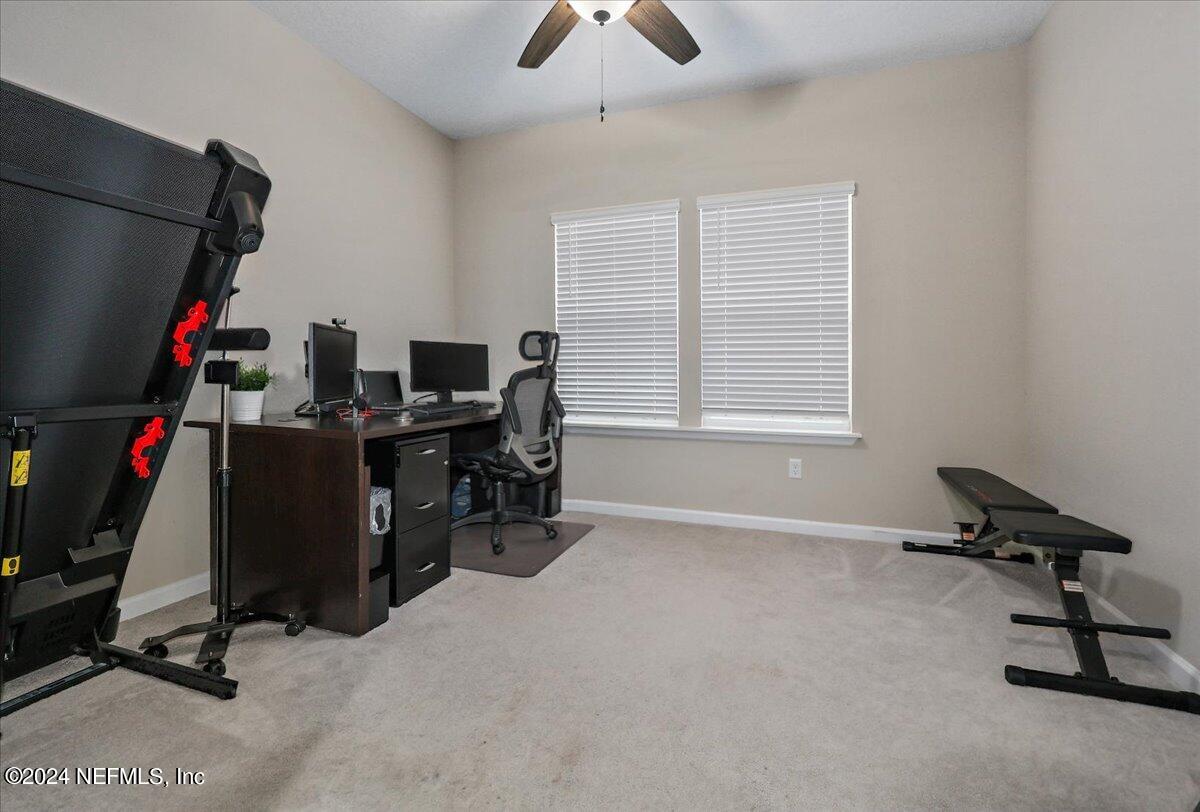 306 Brown Bear Run St. Johns, FL 32259 - Photo 11 of 24 a view of a workspace with furniture and a window