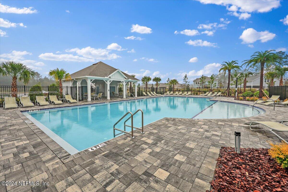 306 Brown Bear Run St. Johns, FL 32259 - Photo 23 of 24 a view of a lake with a house