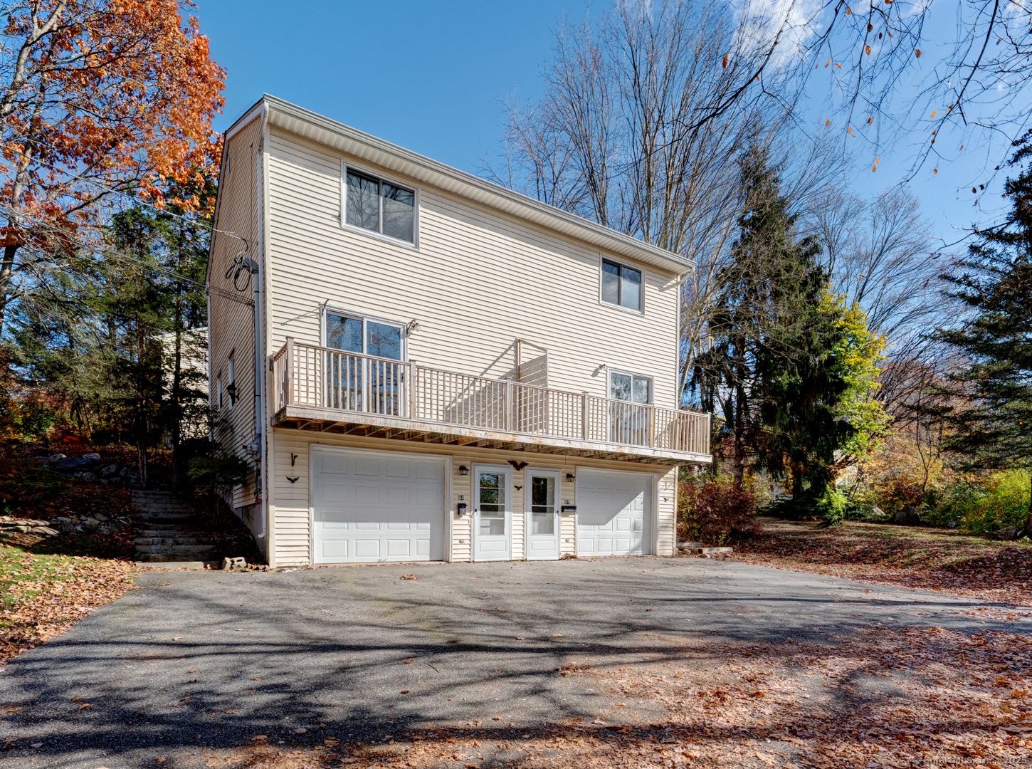 a house that has a tree in front of it