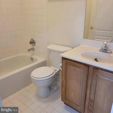 a bathroom with a sink toilet and bathtub