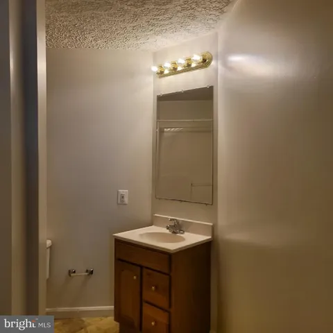 a bathroom with a sink and mirror