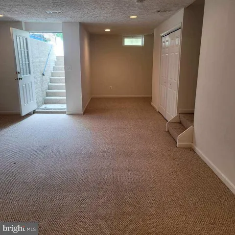 a view of a room with a hallway