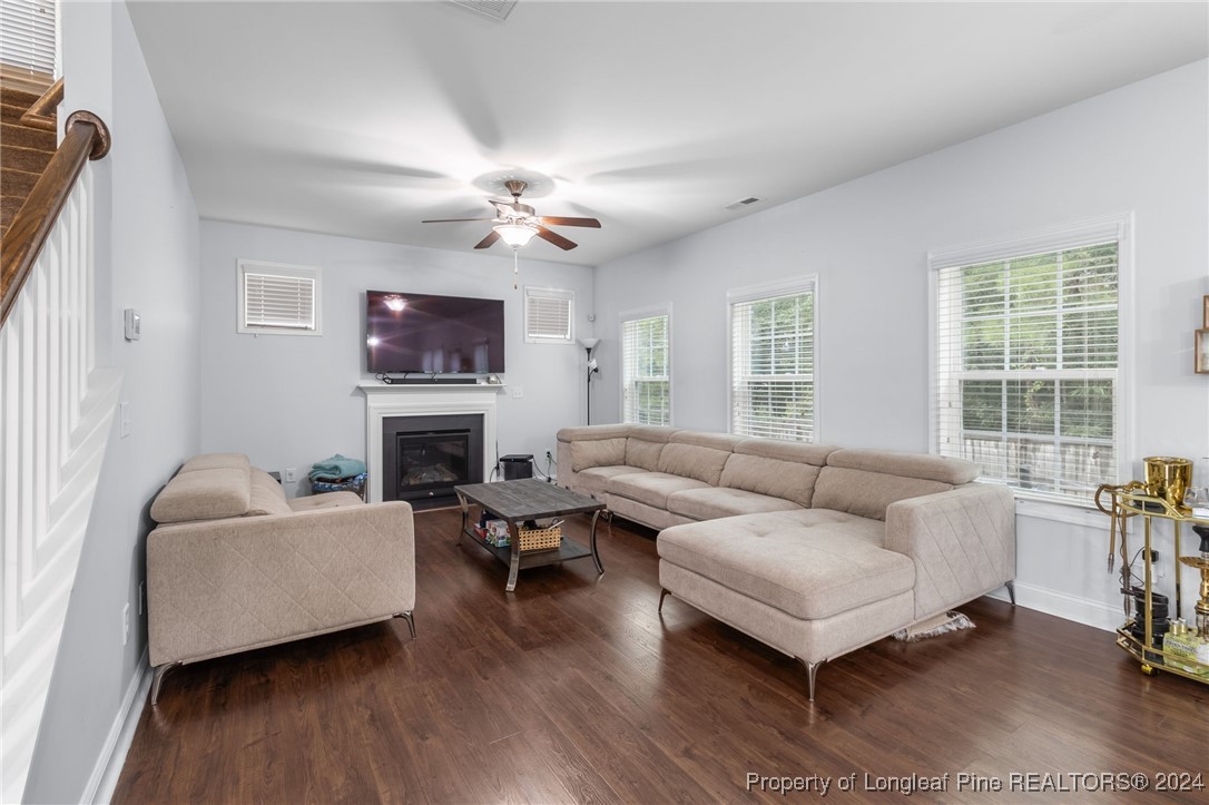 180 Pittfield Run Cameron, NC 28326 - Photo 11 of 33 a living room with furniture a fireplace and a large window