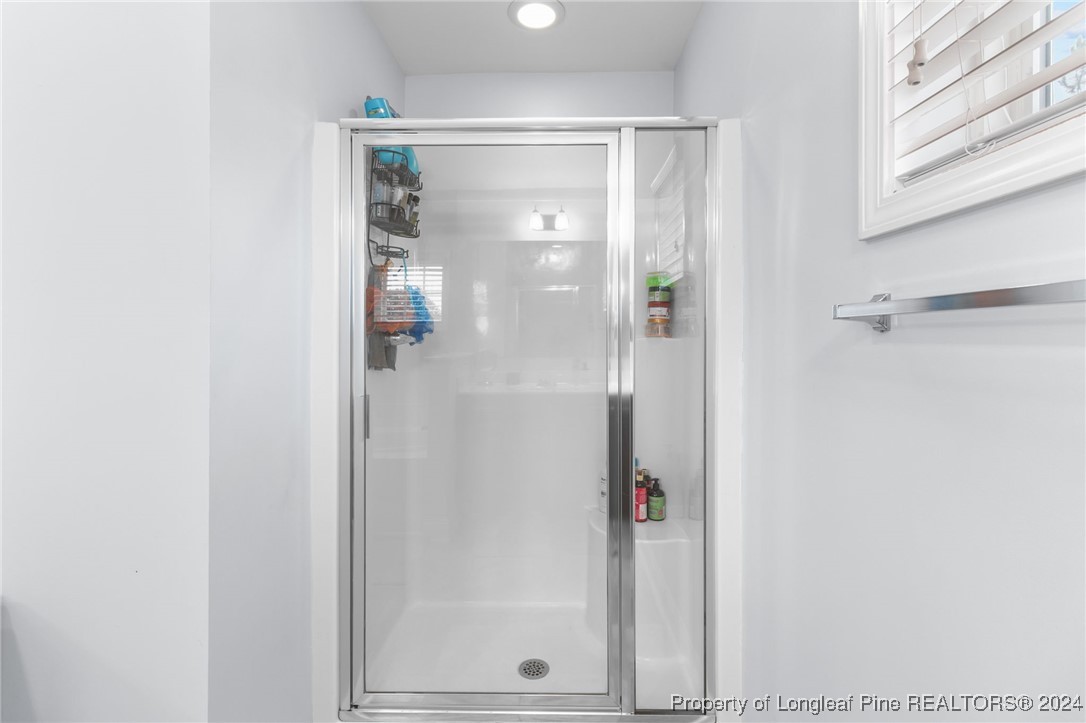 180 Pittfield Run Cameron, NC 28326 - Photo 20 of 33 a bathroom with a glass shower door