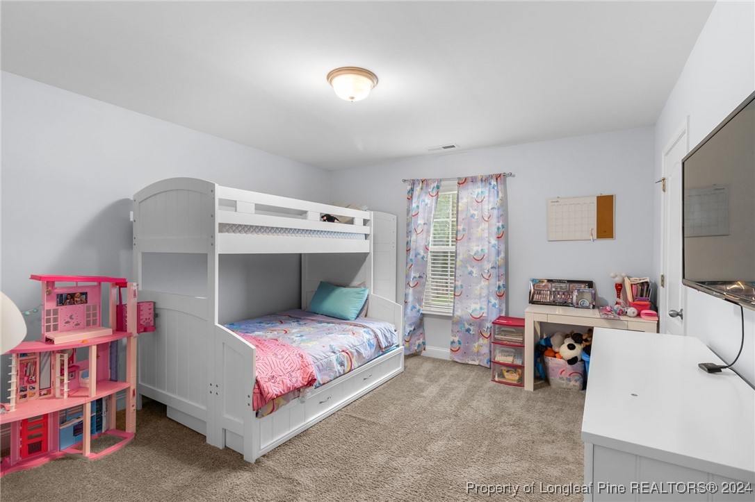 180 Pittfield Run Cameron, NC 28326 - Photo 25 of 33 a bedroom with a bed and a window