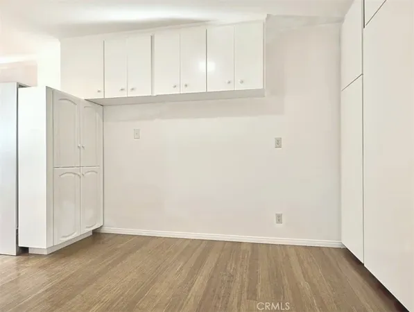 an empty room with wooden floor