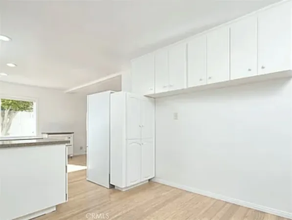 a view of cabinets with wooden floor