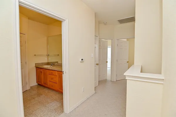 a view of an empty room and fire place