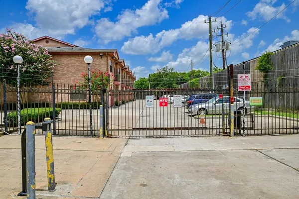 a view of a wrought iron fences in front of house