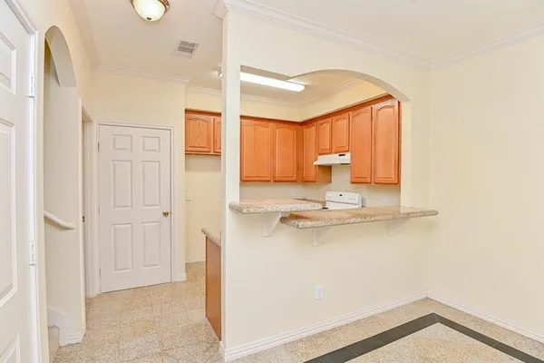 a view of a kitchen with a sink and a window