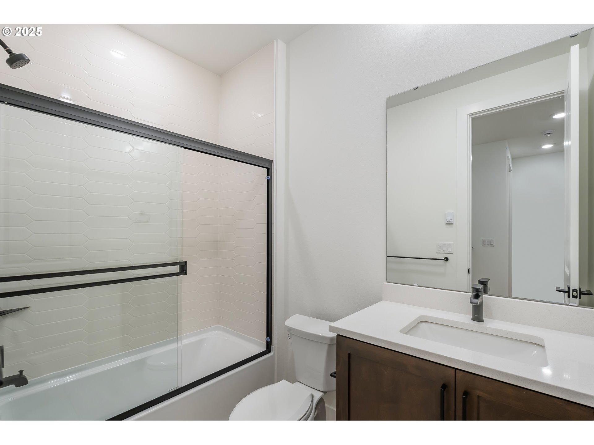 6483 Northwest Olympic Lane, Unit L28 Camas, WA 98607 - Photo 12 of 42 a bathroom with a sink and a mirror