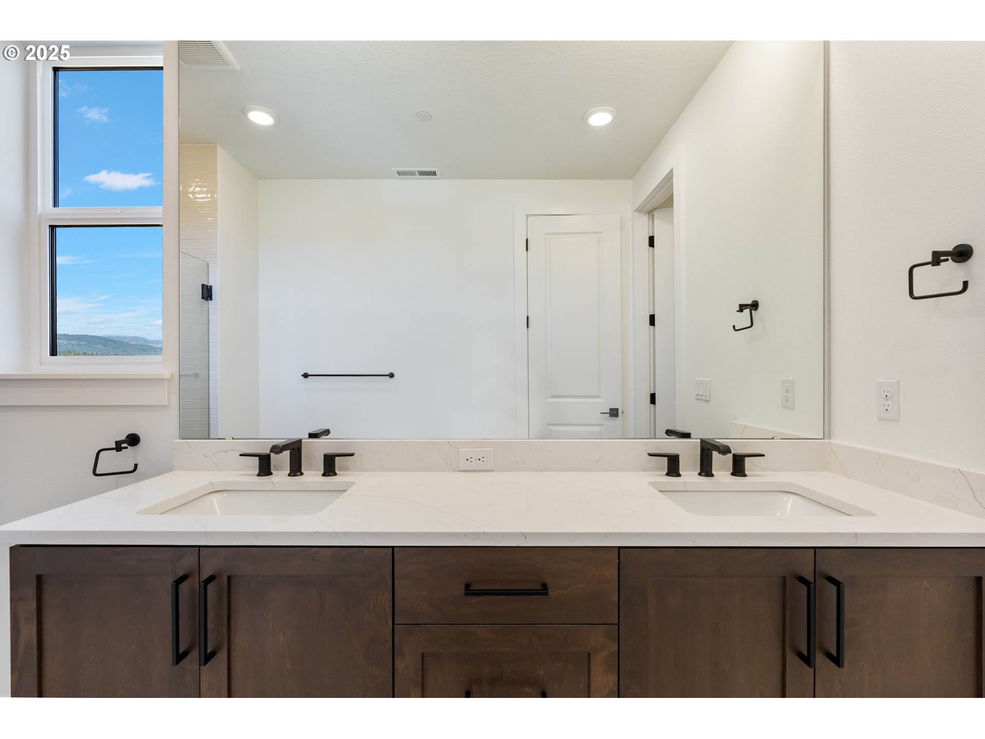 6483 Northwest Olympic Lane, Unit L28 Camas, WA 98607 - Photo 19 of 42 a bathroom with a sink and a mirror