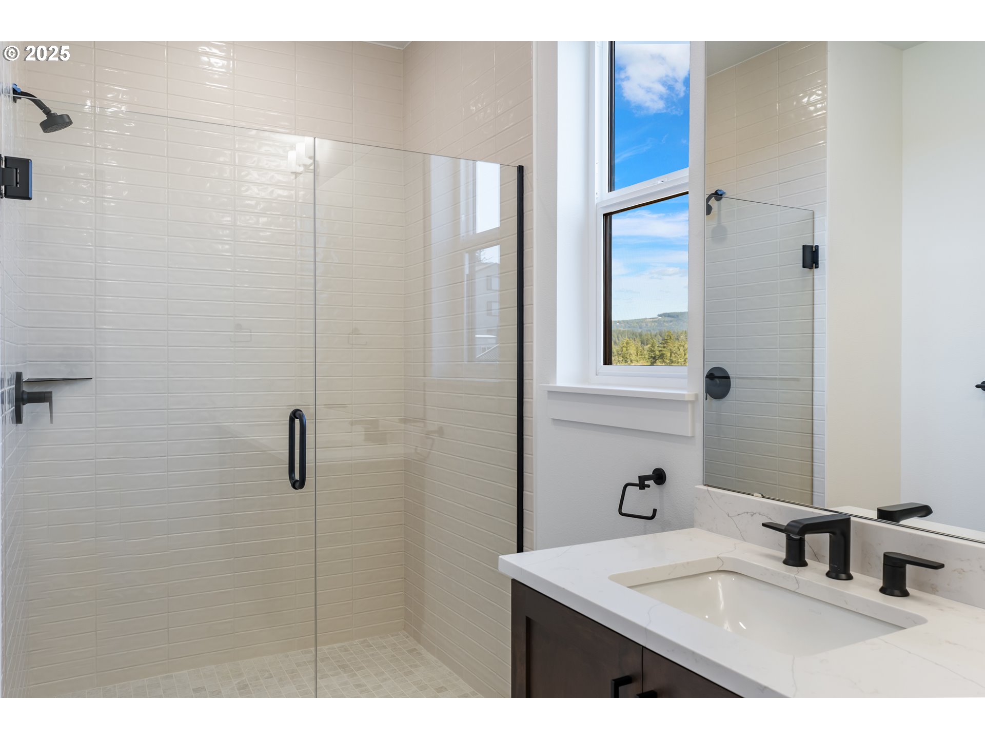 6483 Northwest Olympic Lane, Unit L28 Camas, WA 98607 - Photo 20 of 42 a bathroom with a sink and a mirror