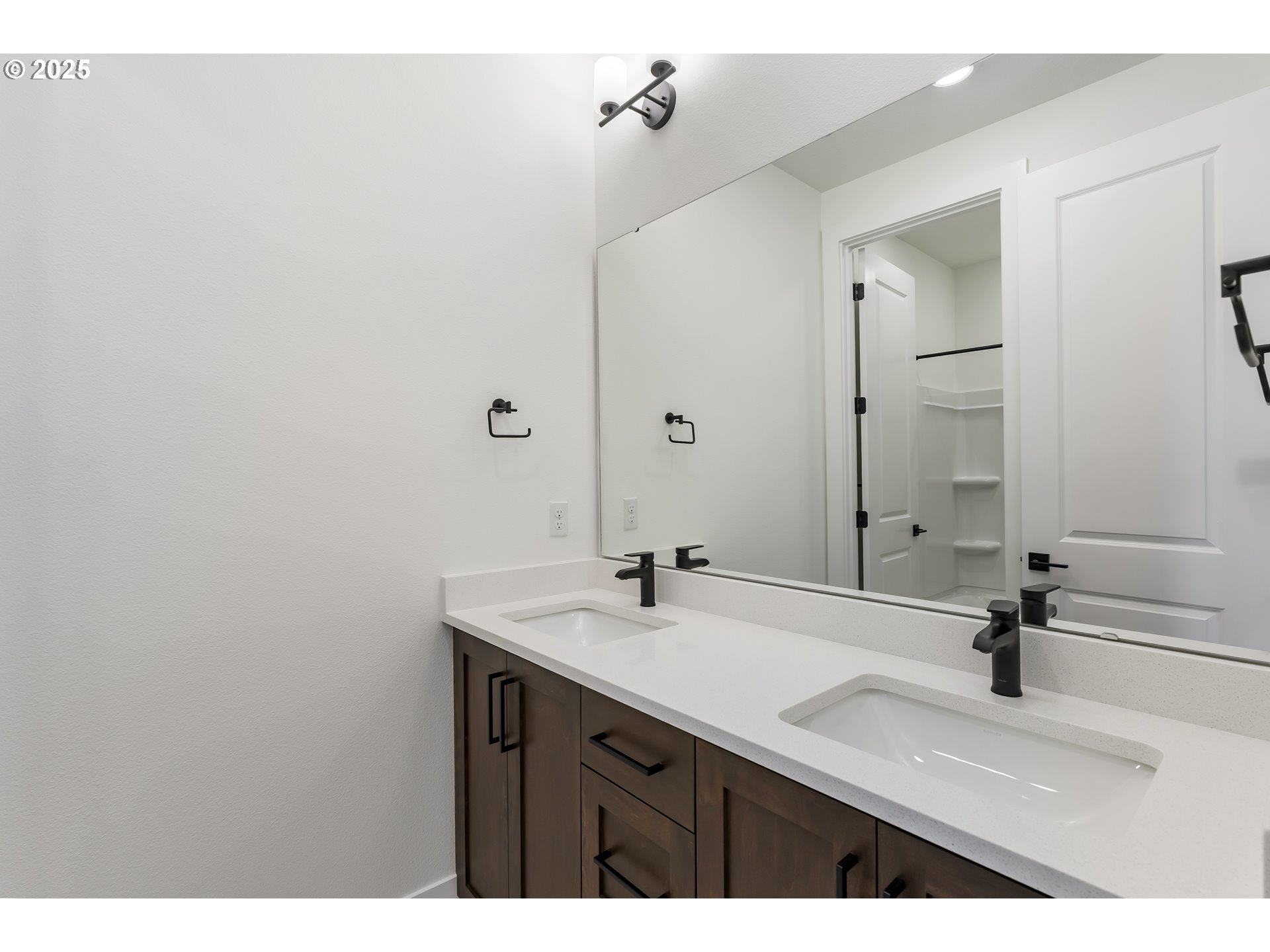 6483 Northwest Olympic Lane, Unit L28 Camas, WA 98607 - Photo 26 of 42 a bathroom with a sink and a mirror