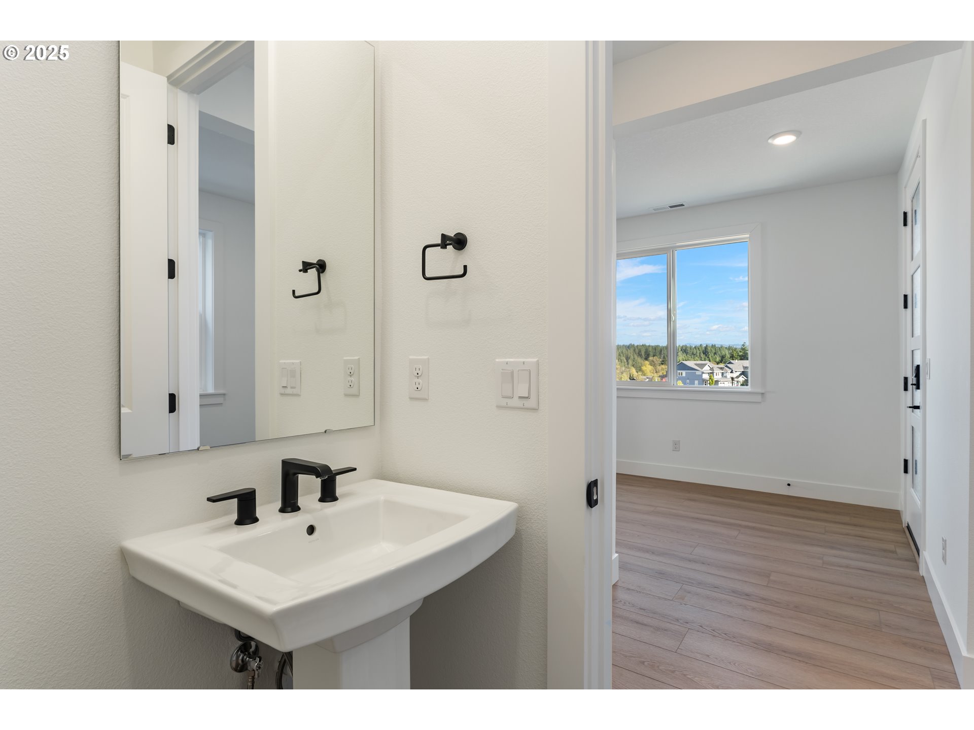 6483 Northwest Olympic Lane, Unit L28 Camas, WA 98607 - Photo 38 of 42 a bathroom with a sink a toilet and a mirror