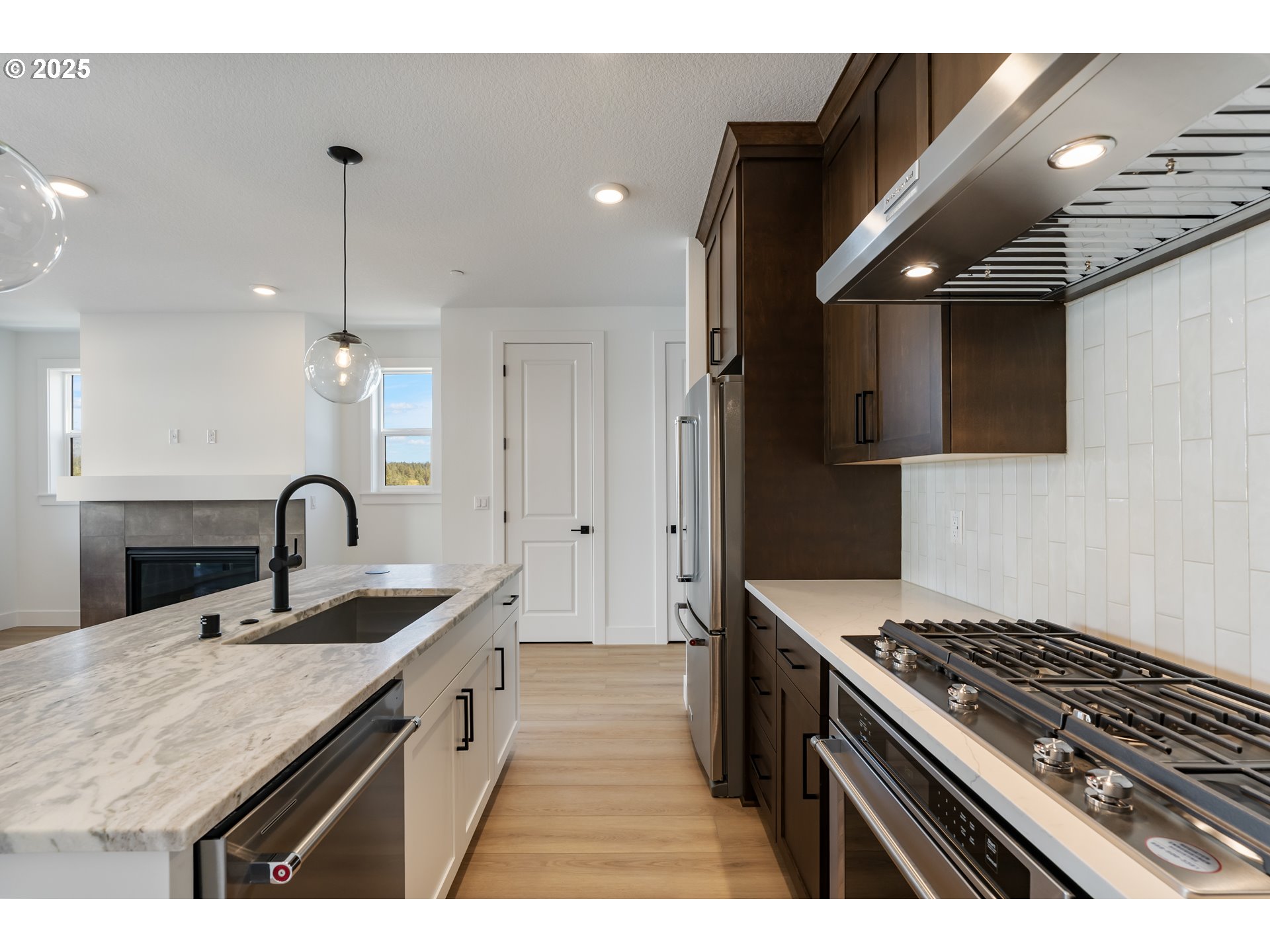 6483 Northwest Olympic Lane, Unit L28 Camas, WA 98607 - Photo 42 of 42 a kitchen with sink stove and cabinets