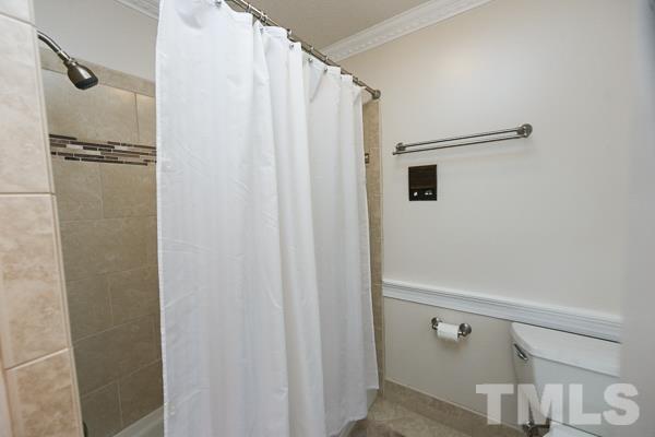 7108 Kinross Drive Raleigh, NC 27613 - Photo 17 of 25 a bathroom with a shower