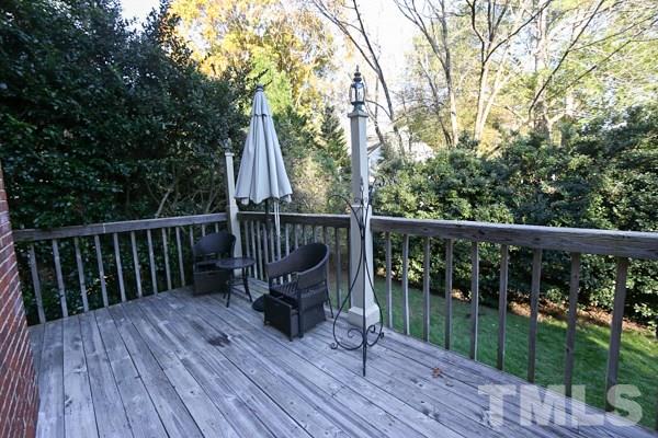 7108 Kinross Drive Raleigh, NC 27613 - Photo 23 of 25 a view of balcony with wooden floor and fence