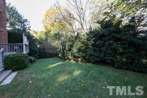 7108 Kinross Drive Raleigh, NC 27613 - Photo 24 of 25 a view of a backyard with a garden