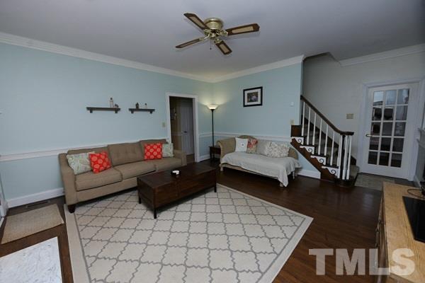 7108 Kinross Drive Raleigh, NC 27613 - Photo 6 of 25 a living room with furniture and a table