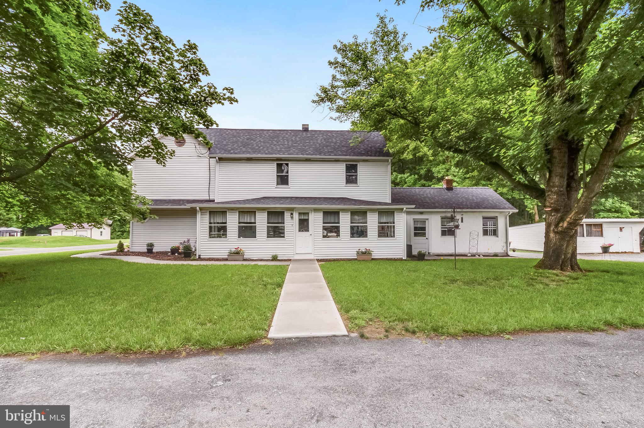 5634 Pearsons Corner Road Dover, DE 19904 - Photo 1 of 40 a front view of a house with a garden and yard