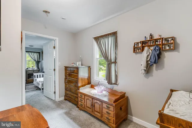 a room that has a bed and a window