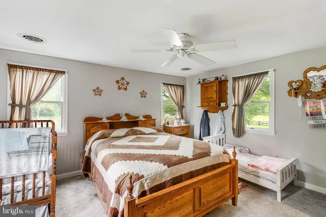 a bedroom with bed and window