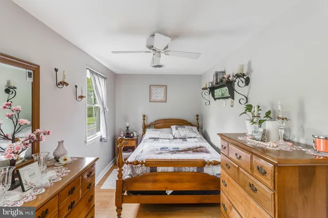 a bedroom with furniture and a window