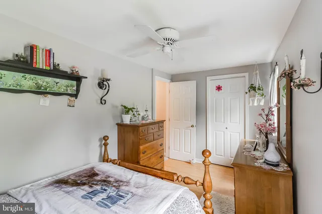 a bedroom with furniture and a fireplace