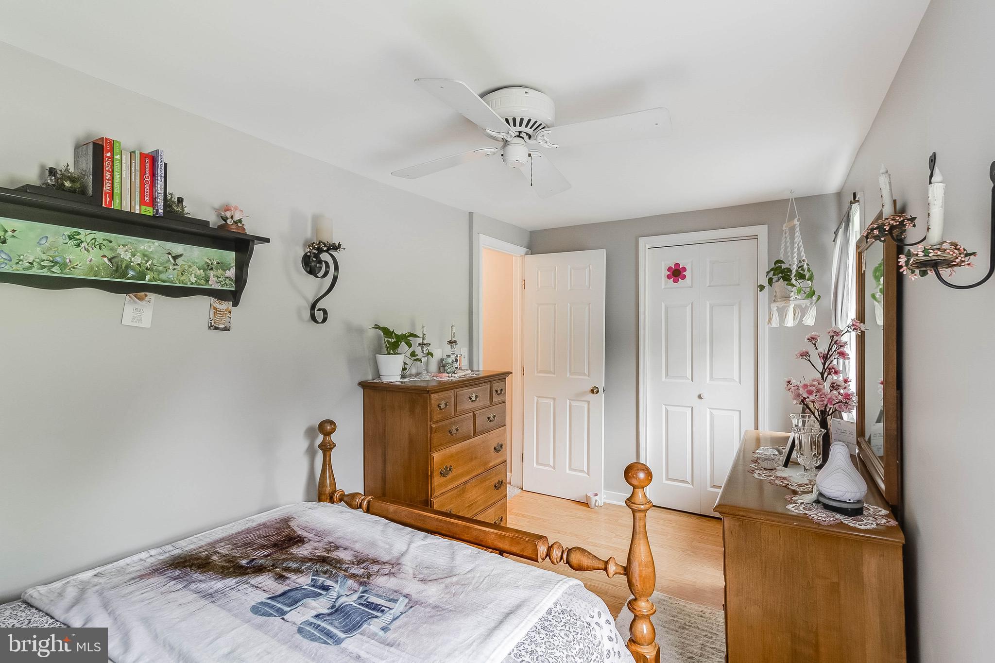5634 Pearsons Corner Road Dover, DE 19904 - Photo 19 of 40 a bedroom with furniture and a fireplace